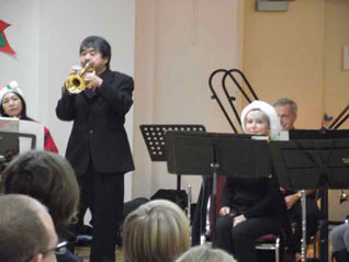 conductor Tak plays his trumpet