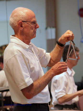 playing
                the triangle